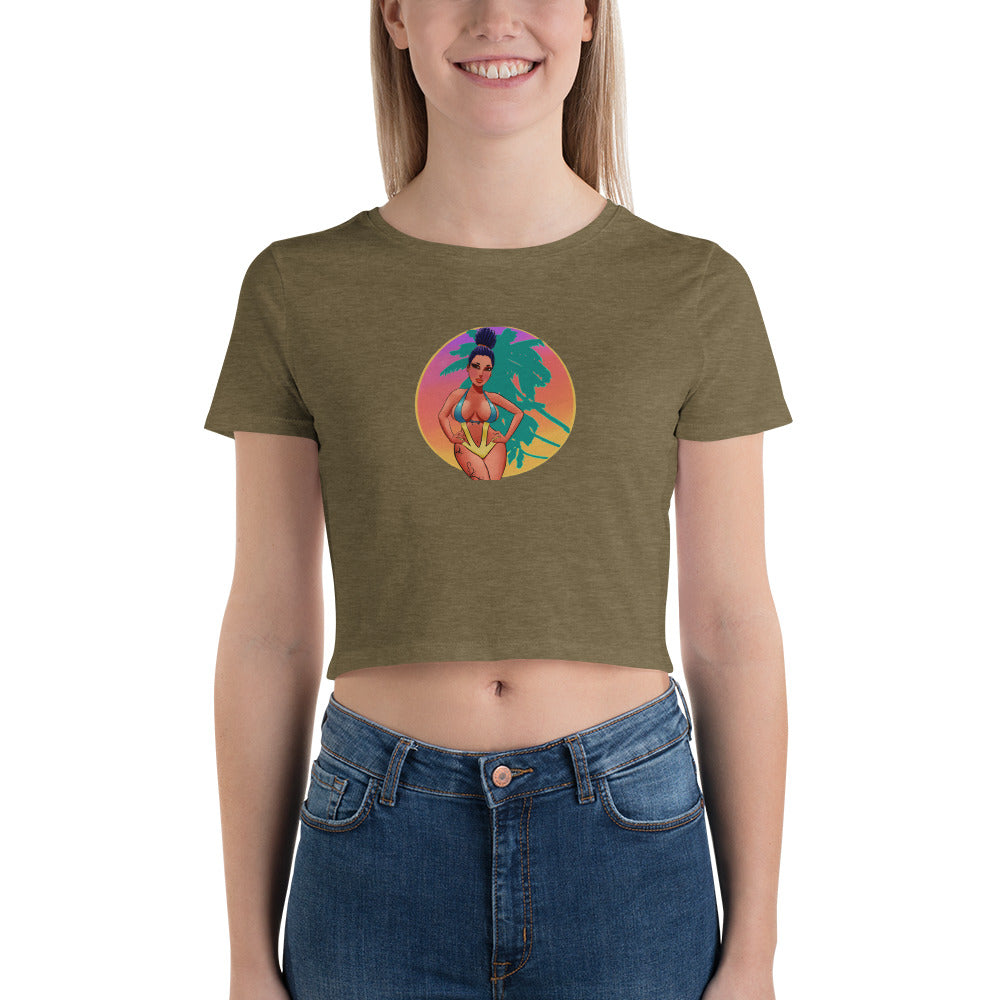 olive green women's crop top with bikini girl on front standing in front of palm trees